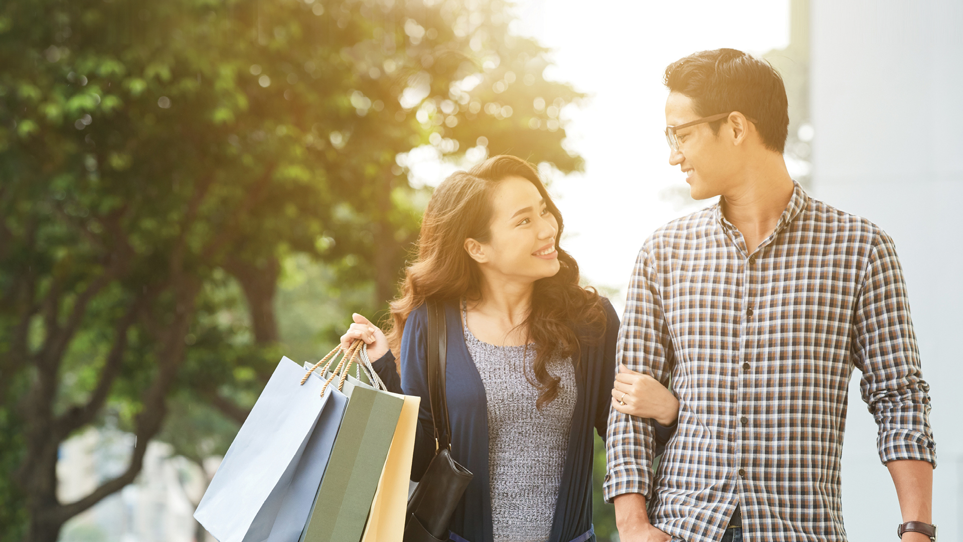 Couple shopping with their SESLOC Visa Debit Card.