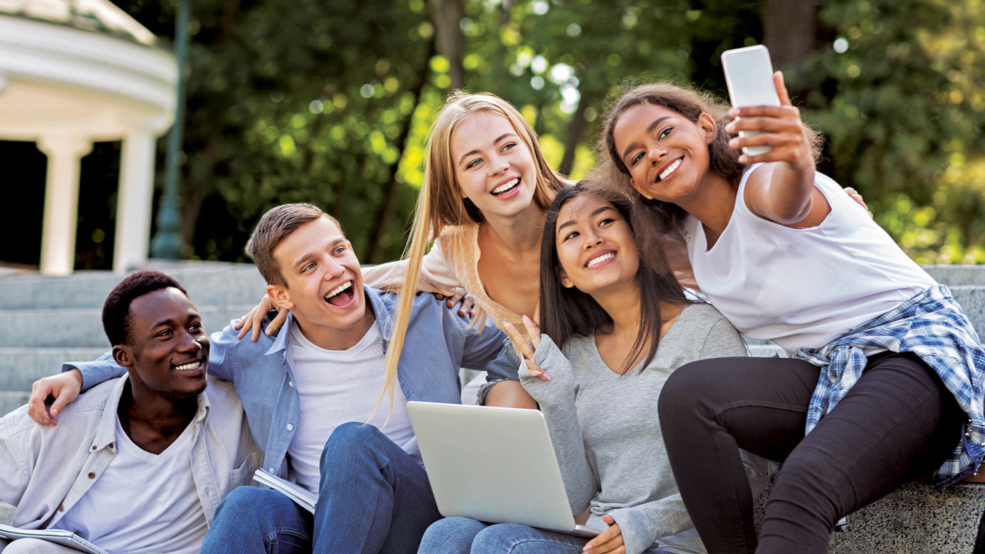 Cal Poly students taking a selfie outside.