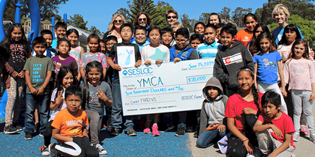SESLOC presents a check to the YMCA