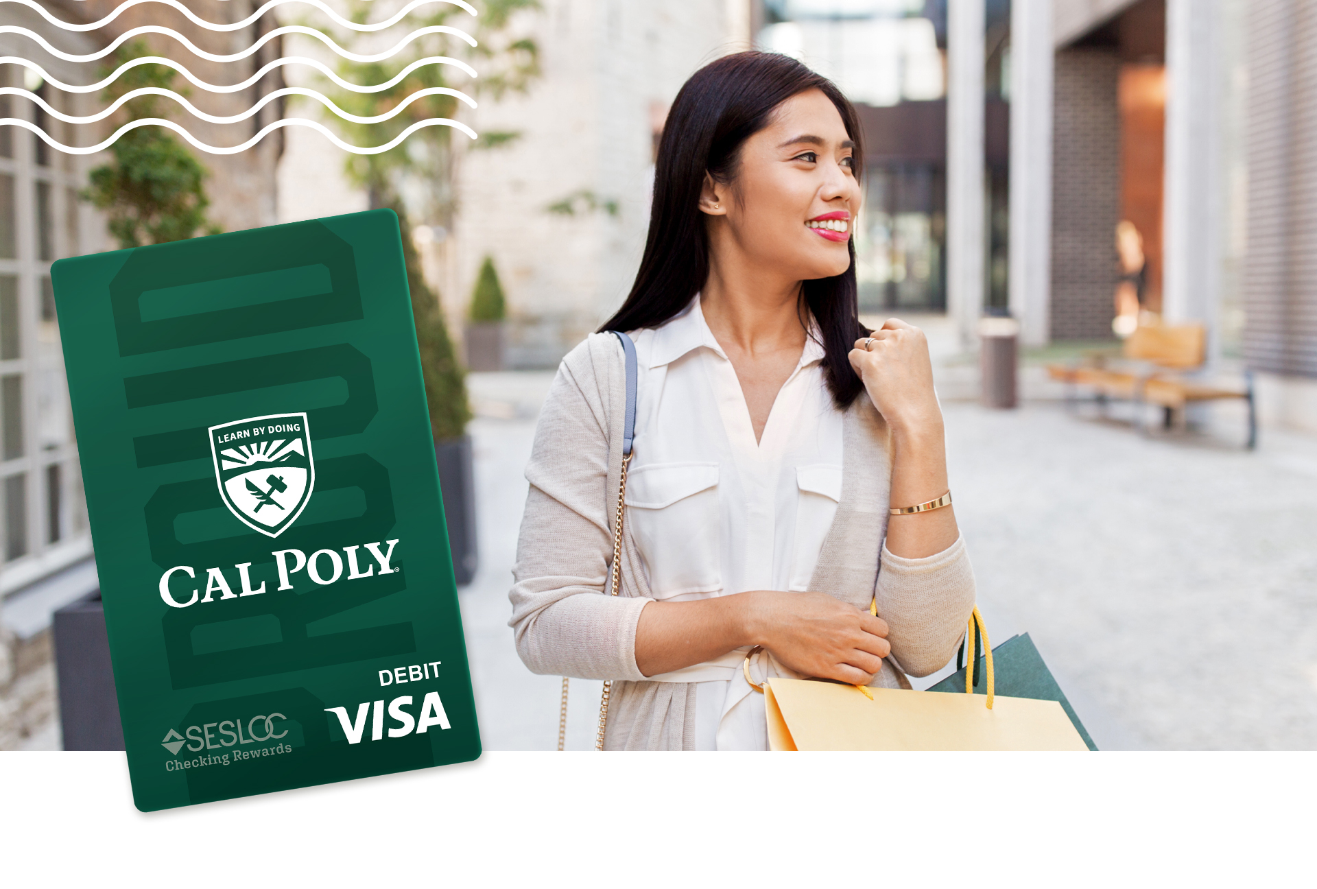A woman is out shopping with her Cal Poly Visa debit rewards card.