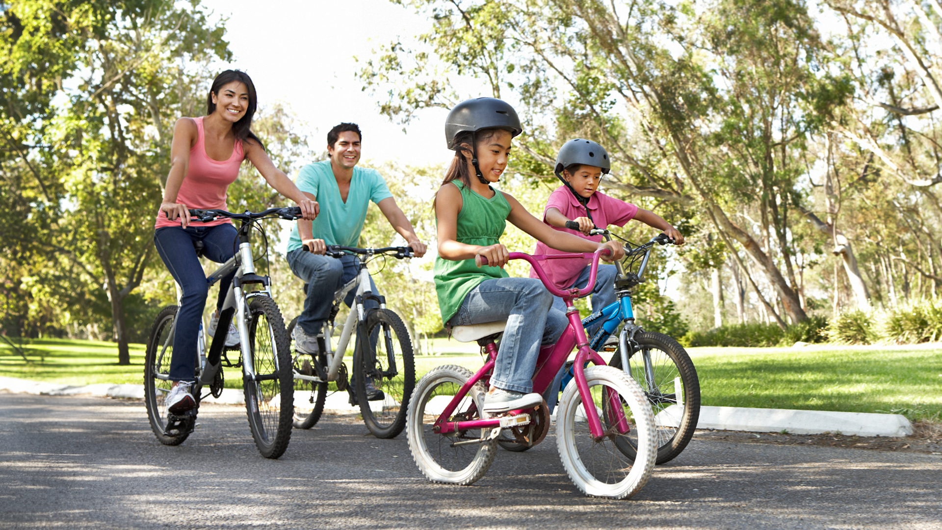 A family enjoys a bike ride on the Central Coast.