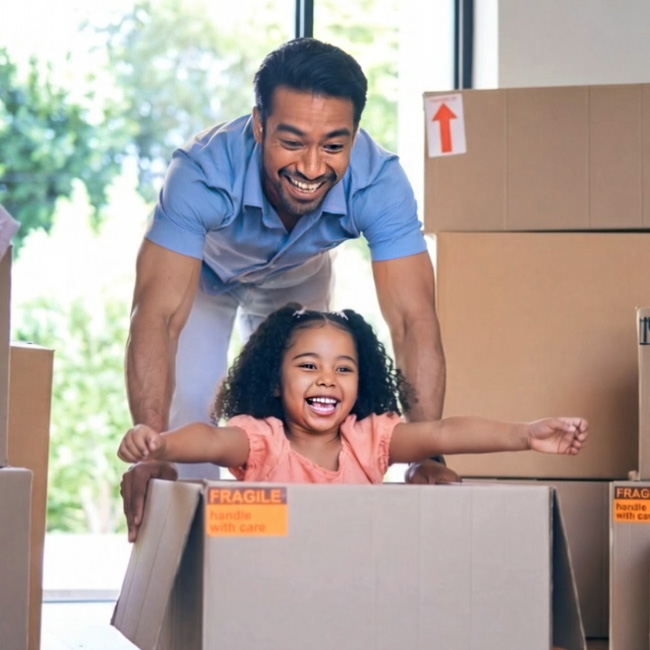 Happy dad and daughter moving in